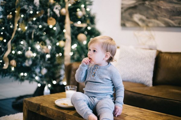 <img src="holiday.jpg" alt="toddler by Christmas tree">